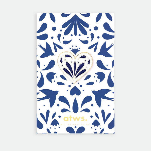 Blue Heart enamel pin by All the Ways to Say featuring gold-plated blue and white heart design on illustrated floral pattern background with swallows.