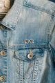 Girl Bye - Pins: stylish "girl bye" sunglasses pin worn on the pocket of a light blue denim jacket.