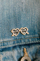 Girl Bye - Pins: heart-shaped sunglasses enamel pin with "girl bye" text on a denim jacket.