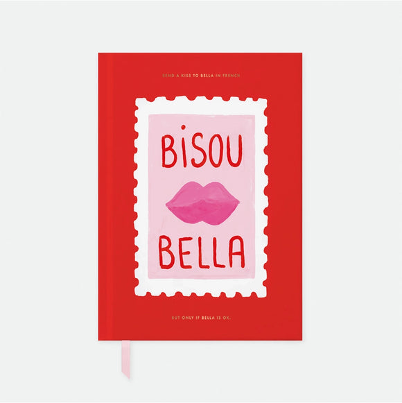 A5 Hardcover notebook with a vibrant red cover featuring a pink stamp illustration with lips and the text Bisou Bella by All the Ways to Say.