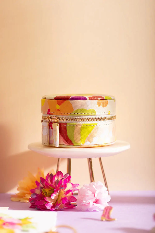 Spring Sweets Jewellery box - Front view of the round travel case on a display stand.