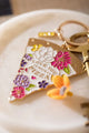As much as pizza Keychain - Detailed view of the hand-painted flowers and "Love you" message.