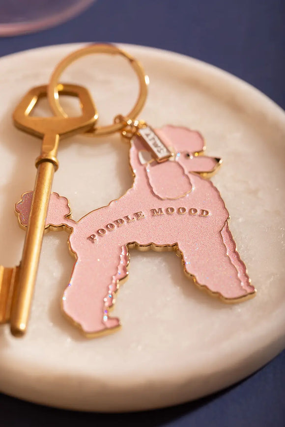 Poodle mood Keychain - Detailed view of the pink glitter poodle and golden "POODLE MOOOD" engraving.