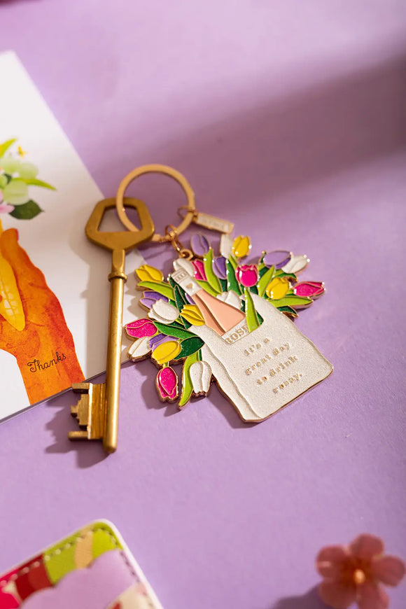 Rosay day Keychain - Lifestyle view on a purple background with a vintage key and "Thanks" greeting card.