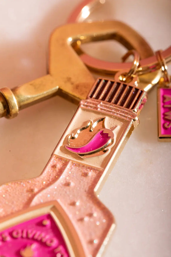 Spicy & Hot Keychain - Close-up of the bottle neck featuring a pink chili pepper and flame design.