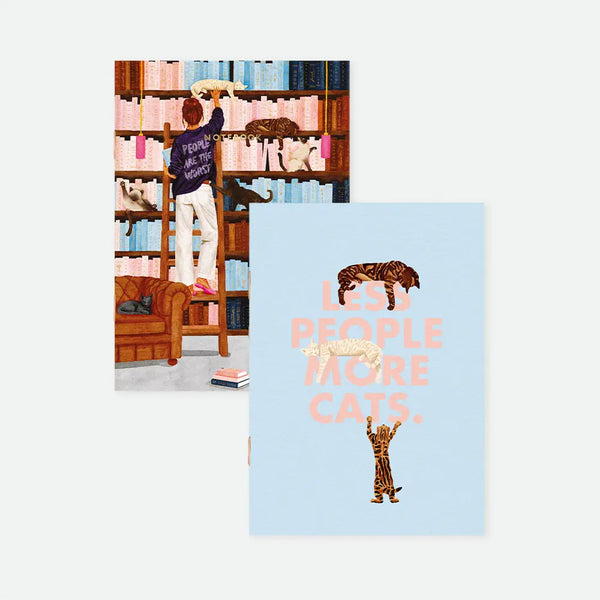 Less People More Cats A6 pocket notebook duo covers by All The Ways To Say, one notebook featuring a woman on a library ladder reaching for a cat with "People are the worst" text on her sweater, the other featuring cats and "Less people more cats." text on a light blue background