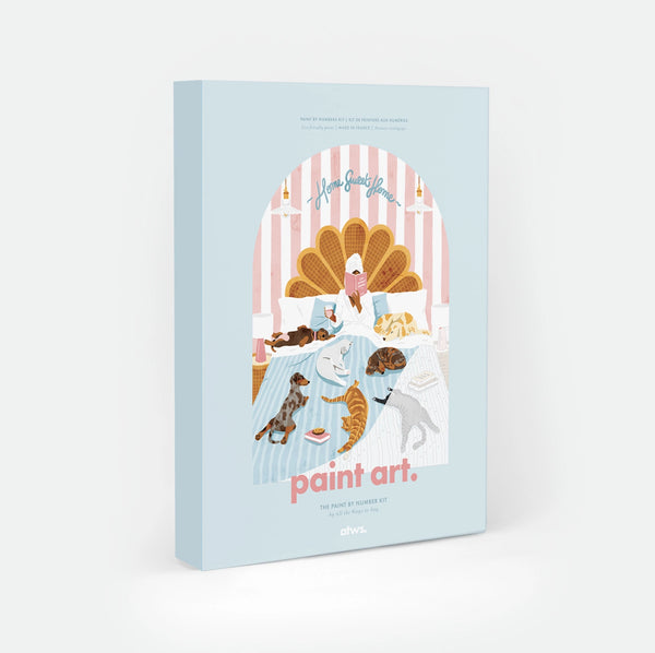 Life Without Humans paint by numbers kit box by All The Ways To Say, illustration of a person reading in bed surrounded by four dogs and three cats, "Home Sweet Home" text arched over a scalloped headboard, "paint art. The Paint By Number Kit by All The Ways To Say"