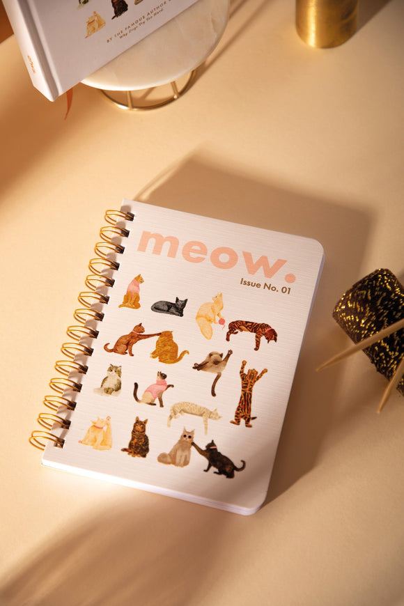 "Meow" A5 spiral notebook with illustrated cats in playful poses, pink lettering and gold spiral binding