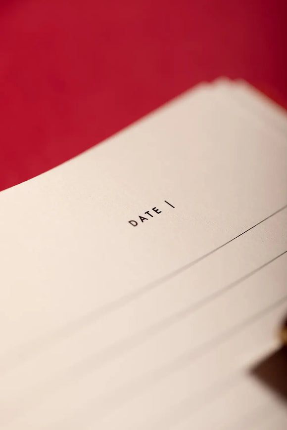 Bisou Bella Hardcover Notebook A5 - Macro shot of the clean lined interior pages and date section.