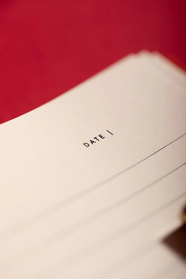 Bisou Bella Hardcover Notebook A5 - Macro shot of the clean lined interior pages and date section.