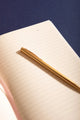 Dogue Hardcover Notebook A5 - View of the lined interior pages with "DATE" header and golden pen.