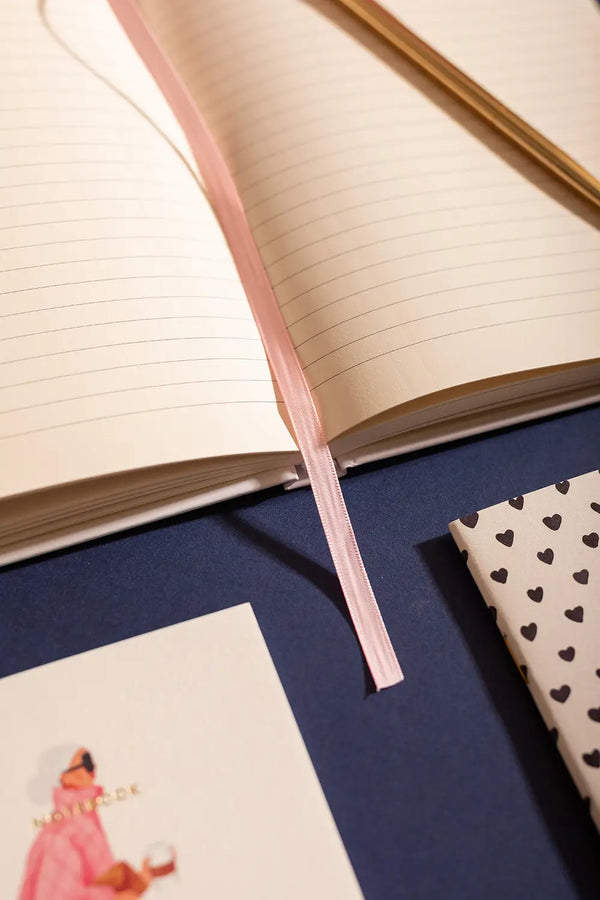 Dogue Hardcover Notebook A5 - Close-up of the pink ribbon bookmark and premium lined paper.
