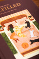 How to be fulfilled Hardcover Notebook A5 - Detailed view of the cozy bed illustration with cats and a dog.