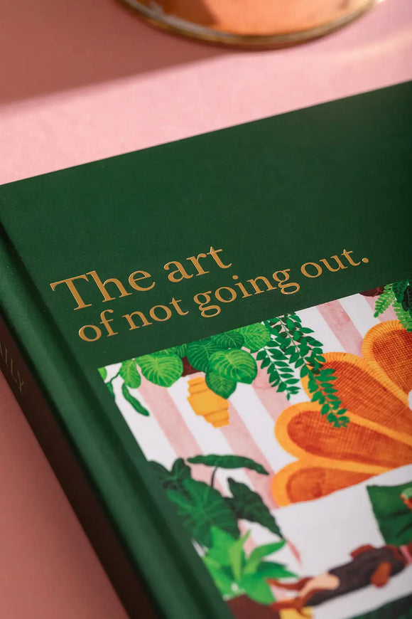 The art of not going out Hardcover Notebook A5 - Close-up of the gold foil title on the dark green cover.