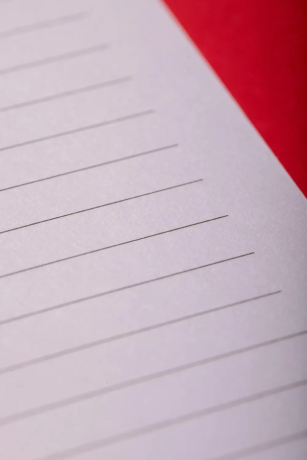 Heart Notebook Spiral - Macro view of the clean lined paper and natural white texture.