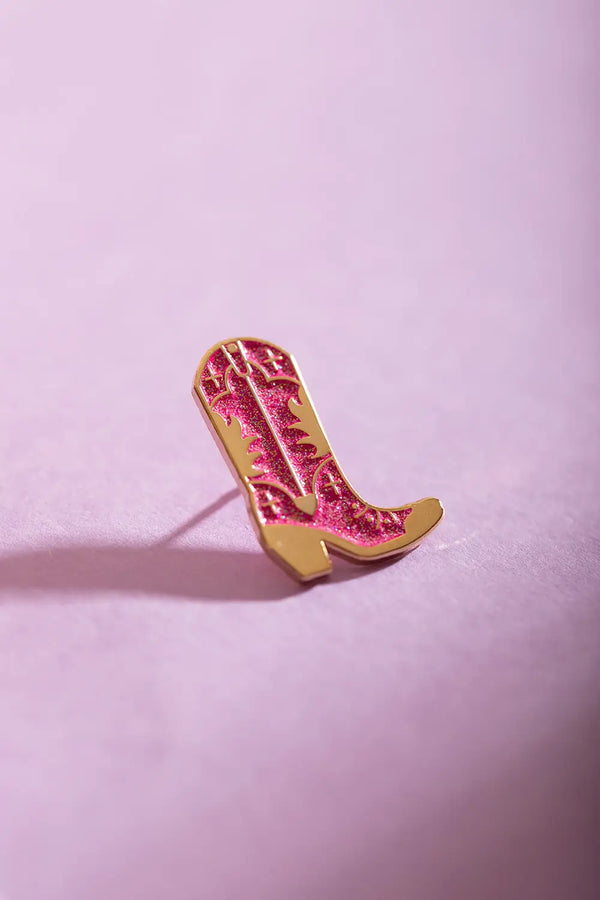 Pink Santiag - Pins: close-up shot of the sparkling pink enamel and gold-plated finish of the santiag boot pin.
