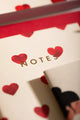 Bisou Pocket Notebook A6 DUO - Close-up of the "NOTES" title in gold foil on heart pattern.