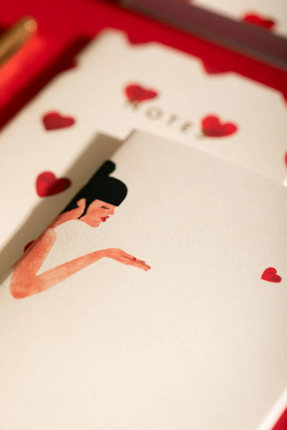 Bisou Pocket Notebook A6 DUO - Focus on the woman blowing a kiss illustration.