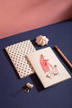 Dalmatian Pocket Notebook A6 DUO - Lifestyle view on a navy desk with a pink pencil.