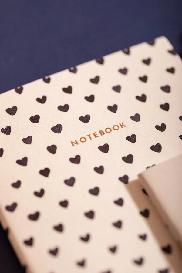 Dalmatian Pocket Notebook A6 DUO - Close-up of the black heart pattern and gold foil title.