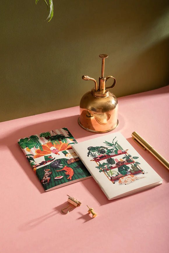 Life with Pets & Plants Pocket Notebook A6 DUO - Lifestyle view on a pink desk.