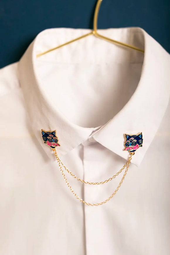 Duo Tiger Chain - Pins: three-eyed tiger enamel pins with connecting gold chains on a crisp white shirt.